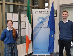 Photo of a student and teacher with flags of Ireland and the EU