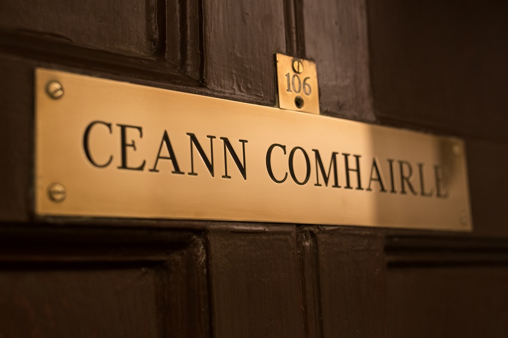 Brass door plate reading "Ceann Comhairle"