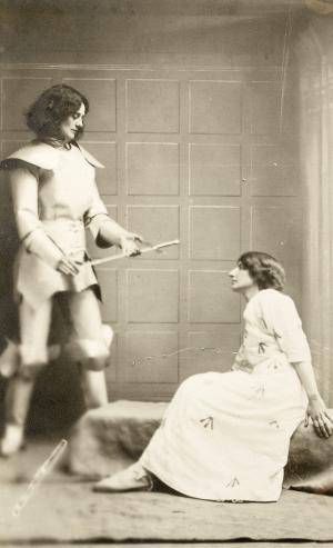Countess de Markievicz dressed as Joan of Arc presenting a sword to a suffrage prisoner