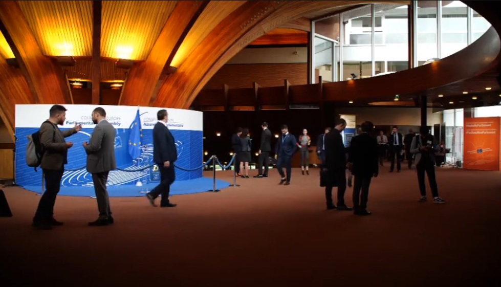 Still from documentary showing delegates at the Parliamentary Assembly of the Council of Europe (PACE)