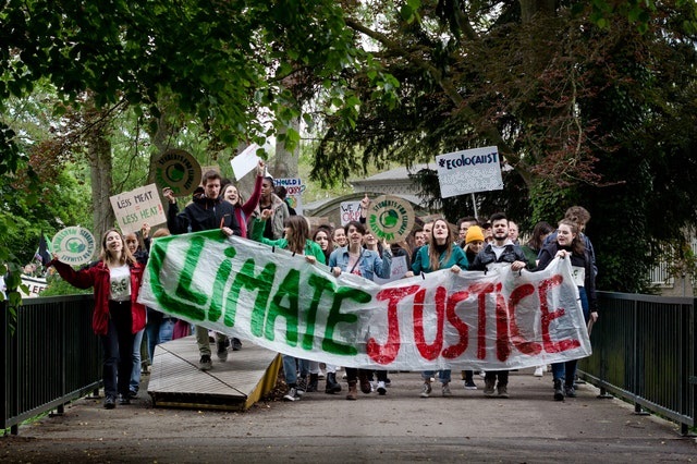Young people carrying climate justice banner